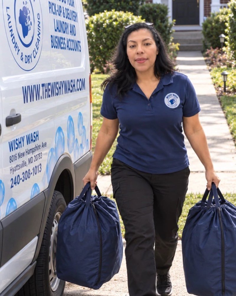 Two Wishy Wash laundry bags being carried from the delivery van to a front door