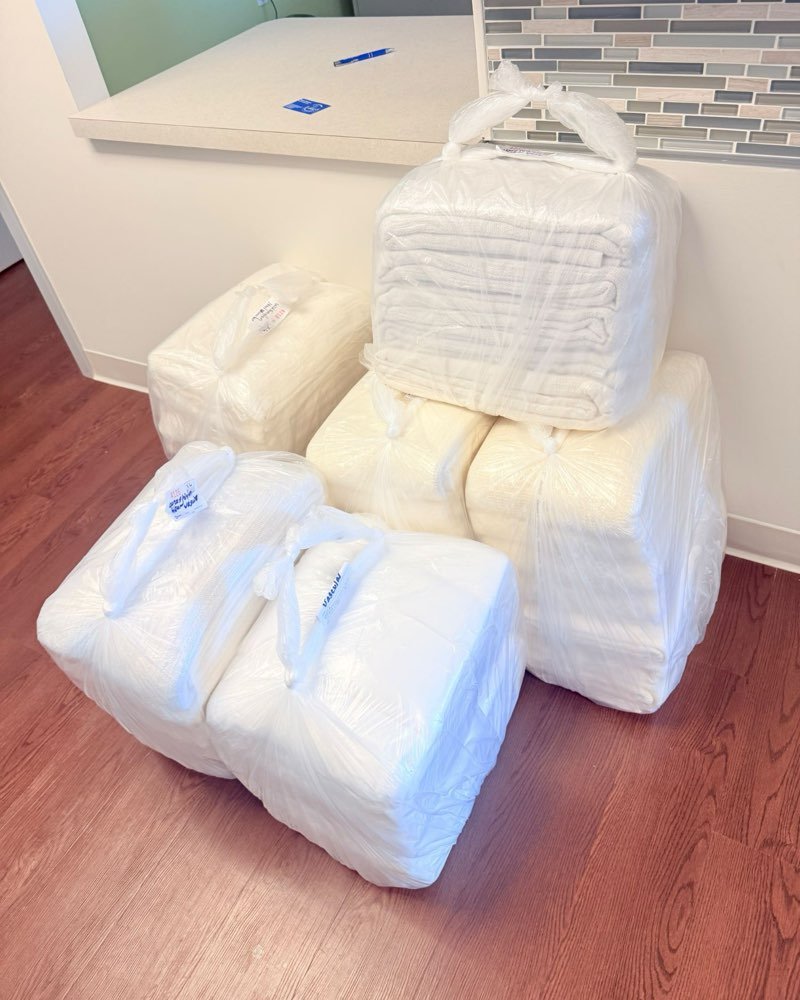 Clean laundry wrapped in clear plastic bundles